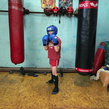 A boy at a Thai boxing training session.
