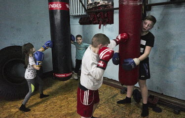 Children at a Thai boxing lesson.