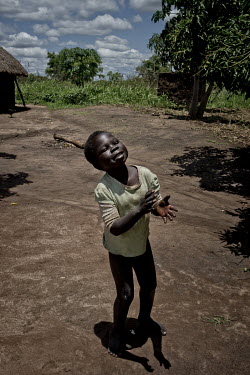 Kenneth Ouma (13) who suffers from Nodding Syndrome. He runs tirelessly around the family compound, laughing and clapping his hands. He does not like to wear clothes and gets rid of his trousers regul...