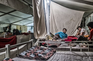 Pakistani refugees resting in beds in a dormitory at the Bira International Organization for Migration (IOM) refugee camp. They claim to have made an attempt to cross the Croatian border on foot but w...