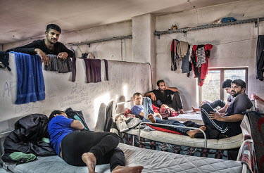 Pakistani refugees resting in beds in a dormitory at an International Organization for Migration (IOM) refugee camp. They claim to have made an attempt to cross the Croatian border on foot but were fo...