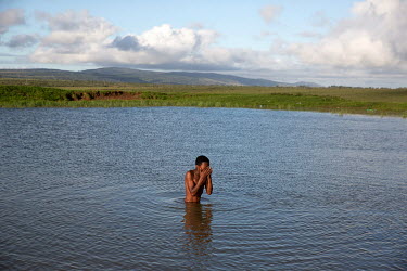 A boys swims in a pond in Makhanda (formerly known as Grahamstown), a town notorious for its sanitation problems.