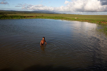 A boys swims in a pond in Makhanda (formerly known as Grahamstown), a town notorious for its sanitation problems.