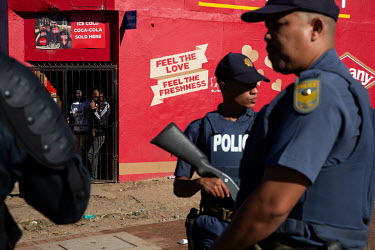 Police stand watch after protesters threw buckets of faeces on the main road as they protested a visit by President Cyril Ramaphosa for a Freedom Day event. The municipality is notorious for its sanit...
