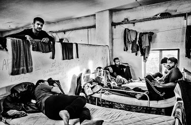 Pakistani refugees resting in beds in a dormitory at an International Organization for Migration (IOM) refugee camp. They claim to have made an attempt to cross the Croatian border on foot but were fo...