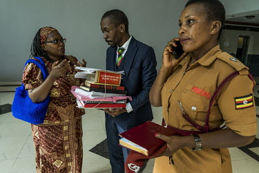 At the High Court on 14 May 2019, Dr Stella Nyanzi talks with one of her lawyers, Isaac Ssemakadde, in a hallway as she waits for the prison van which will drive her back to Luzira prison where she ha...
