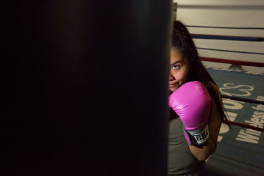 Sandy Ramos (22) works out and mentors teenagers at Capetillo Boxing Academy, in East LA, California. Sandy lives in the heart of gang territory. Her brother Marco was killed by gang members in 2016....