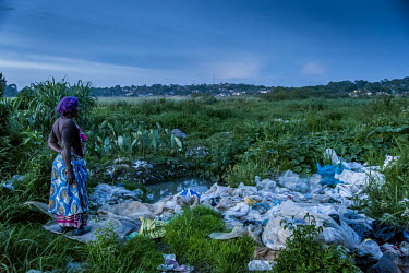 The owner of a small business collecting and washing plastic bags for resale, stands in the open air area where the cleaning takes place. It was reported that 20 young women were murdered in areas aro...