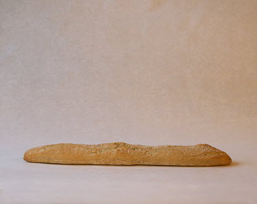 A baguette, a traditional white stick from France, bought in London.