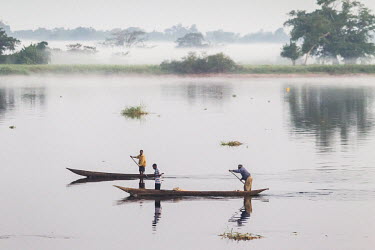 People paddle their canoes (pirogues) to market in order to sell fruit, vegetables and bushmeat.