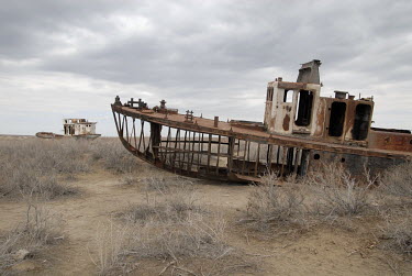 Rusting ships resting on the former seabed of the Aral Sea are slowly being dismantled to recycle their steel. Formerly the fourth largest lake in the world with an area of 68,000 km2, the Aral Sea ha...