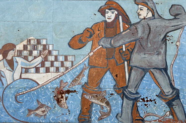A communist-era mural depicting scenes from the town's fishing industry on a building wall in the former fishing port near the Aral Sea. Formerly the fourth largest lake in the world, with an area of...