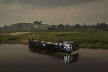 A boat is moored for the night on the banks of the Congo River.