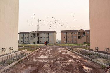 New apartment buildings under construction at the 'Cite du Fleuve' gated community. The development was built by a Chinese developer on an artificial peninsula in the Congo River. Most apartments are...