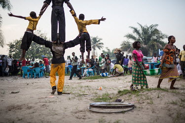 Entertainers try to make a bit of extra money in a makeshift entertainment zone on the banks of the Congo river. The river banks are popular with Kinshasa's population, or Kinois, who come here to par...