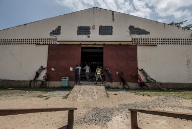 Workers close the heavy metal gates of the Virginia Dare vanilla warehouse in Antsirabe Nord, Madagascar. The warehouse often contains in region of GBP 3.9 million (USD 5m) worth of vanilla and the hi...
