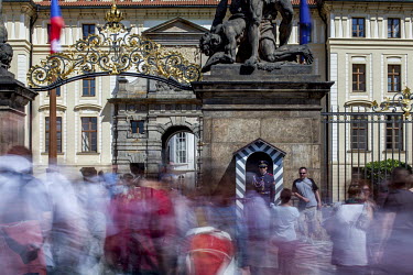 Crowds in front of the Wrestling Titans (Sousosi Souboj Titanu), also known as Fighting Giants and Giants' Gate, a pair of outdoor sculptures leading to the first courtyard of Prague Castle at Hradcan...
