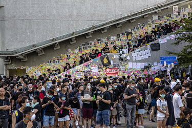 Post-it notes with anti-extradition messages cover a wall near the Legislative Council as a huge crowd, mostly dressed in black, gathered to protest against the extradition bill, police use of force d...