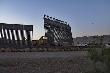 On a privately owned piece of land on the American side of the border, beside Ciudad de Juarez, a metal wall is being erected to stop illegal migration. The fence was privately funded by a group calle...