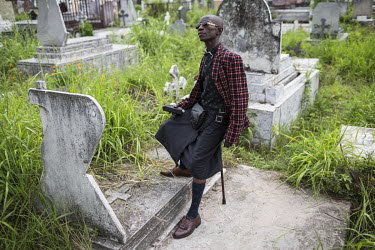 Every year on February 10 sapeurs visit the grave of their spiritual father, the musician Adrien Mombele Samba N'gantshie, aka Stervos Niarcos, in Gombe cemetery.   These often unemployed youngsters c...