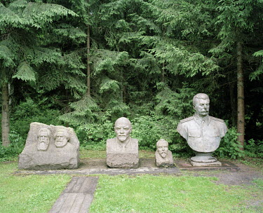 Busts of communist leaders Lenin and Stalin in Grutas Park. The sculpture garden of Soviet-era statues and displays of other ideological relics, was founded by the Lithuanian entrepreneur Viliumas Mal...