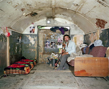 A man sits in his decrepit home in a Roma village on the outskirts of Vilnius, a well-known place to buy heroin. Poverty and unemployment has led to drug dealing in the Roma community of some 500 peop...