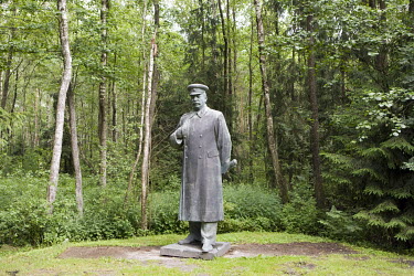 A a giant statue of Stalin in Grutas Park. The sculpture garden of Soviet-era statues and displays of other ideological relics, was founded by the Lithuanian entrepreneur Viliumas Malinauskas. It is u...