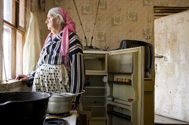 An empty fridge in the home of Shura Risto (88), a Roma woman who lives in extreme poverty in a Roma community on the outskirts of Vilnius.