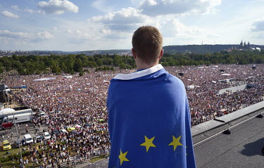 A man draped in an EU flag looks out over a rally in Letna Park which drew a crowd of a quarter of a million people, the biggest protest since the communist era, all demanding the resignation of Prime...