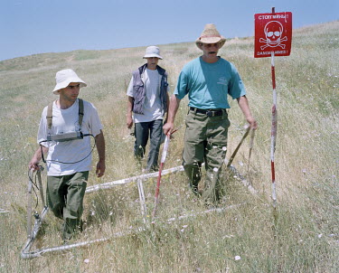 Deminers working for the Halo Trust locate and clear anti-personnel mines buried in the Chartar 5 minefield. During the war between Armenia and Azerbaijan (1988 - 1994) both countries deployed large n...