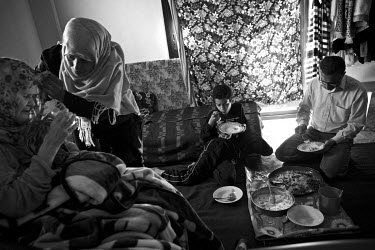 R-L: Naim Aldalou (53), Mohammad Aldalou (10), Noor Aldalou (37) and her paralysed mother. The family is from from the Palestinian refugee camp of Yamook in Syria. In 2013 the forces fighting for cont...