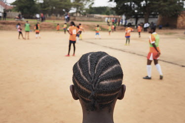 A group of refugee girls, from the Democratic Republic of Congo (aged between 10 and 14 years old), play a short football match. Before and during the match the coach passes on health education messag...