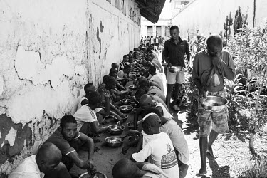 A group of inmates at Marofoto Prison (known to inmates as Marseilles) who receive an extra special daily meal, provided by the Catholic church, for inmates that are showing signs of malnutrition. The...