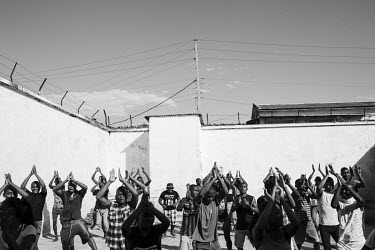 A â��Zumba' aerobics class in a courtyard at Marofoto Prison (known to inmates as Marseilles).   The crowded facility holds on average 650 prisoners in an institution with a capacity for 350. It is...