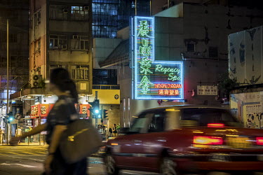 A neon sign hangs above the Regency Spa in Yau Ma Tei.