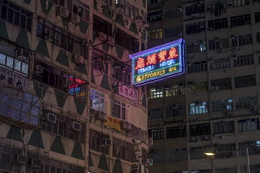 A sign for the Tohou Hotel on Nathan Road in Kowloon. Nathan Road was once famous for its sea of competing neon lights, but in recent years these have all but disappeared, and long stretches of the ro...