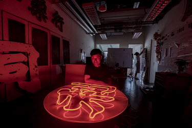A neon sign lies on a table in Professor Brian Kwok's design lab at the Hong Kong Polytechnic University. Kwok salvaged the sign, which had hung outside an Indonesian restaurant for the past three dec...
