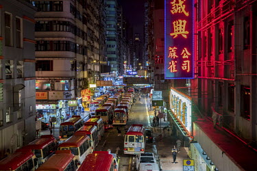A large LED light hangs above a neon one on Sai Yeung Choi street in Mong Kok,. The city's neon lights have been steadily declining in number ever since the 1990s, due to safety regulations and the em...