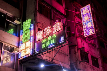 Neon lights jostle among LED ones on Portland Street in Kowloon. The street still retains a handful of prominent neon lights, despite the massive reduction across the city.