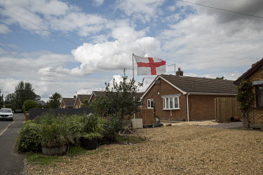 An English Cross of St George flag flies outside a bungalow, in a fenland village, in South Holland.  In the 2016 referendum on Britain's position within the EU, the South Holland district produced th...