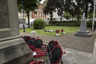 An Eastern European migrant labourer sleeps on a patch of grass at the town's war memorial.   In the 2016 referendum on Britain's membership of the EU, the Boston district produced the highest pro-Bre...