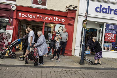 Pedestrians walking past shops in the town centre.  In the 2016 referendum on Britain's membership of the EU, the Boston district produced the highest pro-Brexit vote, 75.6% per cent of the popular vo...