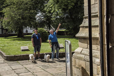 Dog owners chatting outside St Botolph's Church, the symbol of Boston.   In the 2016 referendum on Britain's membership of the EU, the Boston district produced the highest pro-Brexit vote, 75.6% per c...