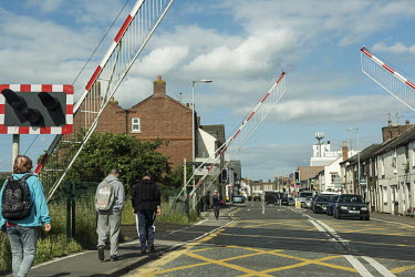 Pedestrians cross at a railway crossing in Spalding, South Holland.  In the 2016 referendum on Britain's membership of the EU, the South Holland district produced the second highest pro-Brexit vote on...