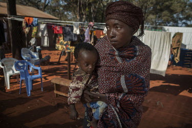 Kashindi Yungi Loine Bwirayesu holds her daughter Andrea who is suffering from malnutrition at the Nyarugusu refugee camp in Tanzania where about 110,000 refugees arrived after they crossed the border...