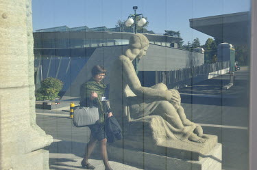 A delegate passes a statue representing 'Peace', at the WTO headquarters.  The World Trade Organisation has 164 members, and in theory, negotiates and regulates global trade. It is, however, in cris...