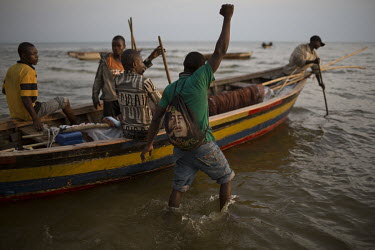 Fishermen head out on to Lake Mweru.  At around five o'clock in the afternoon, fishermen prepare to go out on Lake Mweru. They use floating oil lamps to attract small fish at night. In the morning the...