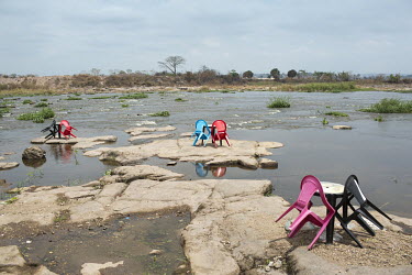 Plastic chairs at Kinsuka Pecheur, a riverside spot popular with middle-class Kinois, who enjoy taking selfies in front of the Congo River.