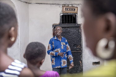 Tour guide Alex shows his group the cells at the Elmina Fort where rebellious slaves or unwilling women were locked up. To get a feel for the inhumane conditions, the guide invites visitors to enter a...