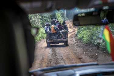 A pick-up carries men hired to fell trees into one of the last areas of rainforest in western Ghana. Logging companies have been granted permits to remove certain trees from the forest for the Europea...